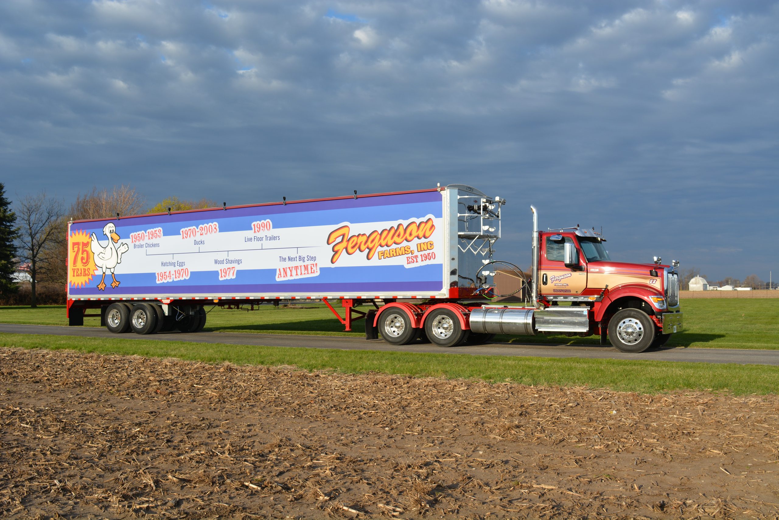 Truck and trailer driving down lane